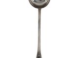 silver spoon with a reflection of a person in it