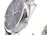 a close up of a wrist watch with a black dial
