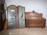 a dresser and mirror in a room with tile flooring