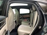 the back seats of a car with the door open and the driver ' s seat down
