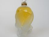 an image of a glass perfume bottle on a white surface