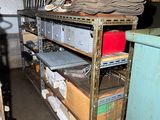 a room with a lot of boxes and shelves in it