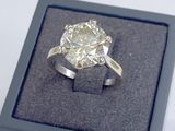 an image of a diamond ring in a box on a table