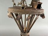 an image of a small table with a statue on it