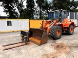 a tractor that is sitting in the dirt