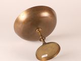 an image of a brass object with a mirror on it