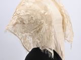 a white lace shawl on a mannequin mannequin mannequin mannequin mannequin mannequin mannequin mannequin mann