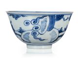 a blue and white bowl sitting on a white surface