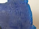 a blue piece of art that is on a table