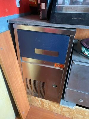 an image of a kitchen with a stove and a refrigerator