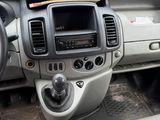 a dashboard of a vehicle with a paper in the passenger seat