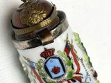 a small lighter with a coat of arms on it