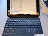 a laptop computer sitting on top of a table with a price tag on it
