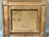 an old picture frame with a picture of a child in it