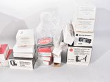 several boxes of different types of electronic equipment sitting on a white surface