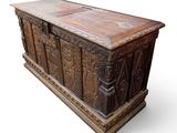 an old wooden chest with carvings and carvings on it