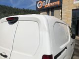 a white van that is parked outside of a building