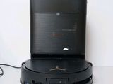 a black device sitting on top of a white table