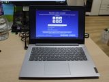 a laptop that is sitting on a desk with a keyboard