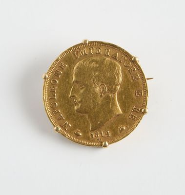 l'image d'une pièce d'or sur laquelle figure le visage d'un homme
