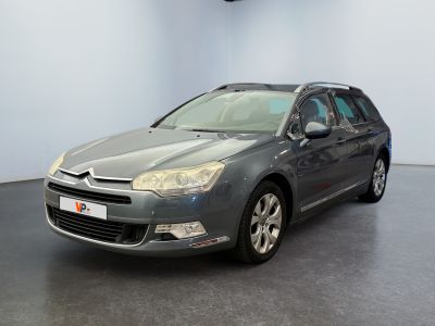 the grey citrole is parked in a room with a black floor
