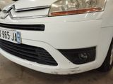 a white car that is parked in a garage