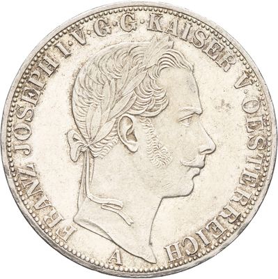 gros plan d'une pièce de monnaie sur laquelle figure un visage de femme