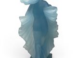 statue of a woman in a blue dress with a hat on her head