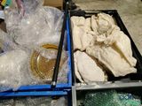 two boxes of plastic items that are sitting on a table