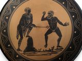 a black and gold plate with a picture of two men playing a game