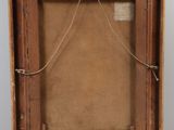 an old wooden easel with an empty canvas on it
