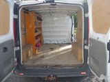 a white van that is open with the door open