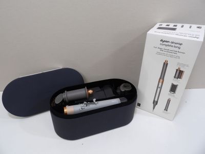 a black box with a pen and a lighter in it