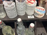 many bottles of water sitting on a shelf in a store