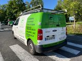 a van that is parked on the side of the road
