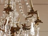 a chandelier hanging from the ceiling in a room