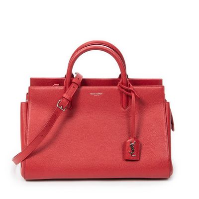 a red handbag on a white background