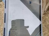 a person holding a tablet computer in their hand