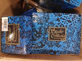 a blue and black box with a bottle of wine in it