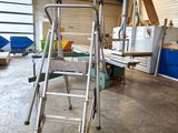 a ladder that is sitting in the middle of a room