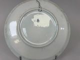 a white plate with a black and white design on it