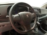 dashboard view of a car with a steering wheel and dashboard controls