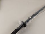 a knife that is wrapped in plastic on a table