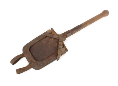 an old iron shovel with a wooden handle on a white background