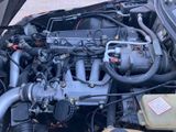 a picture of a car engine with its hood open