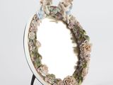 a mirror with a picture of two cherensils on it