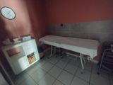 a room with a bed and a table in it
