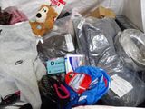 a pile of clothes and other items in a suitcase