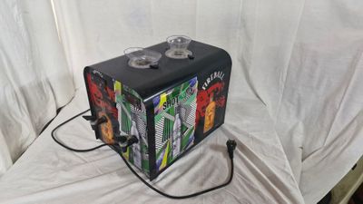 a black suitcase with a design on it sitting on a white sheet