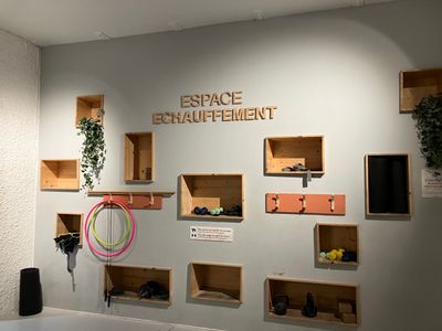 a room with a lot of shelves on the wall and a sign on the wall that says space enquiferment